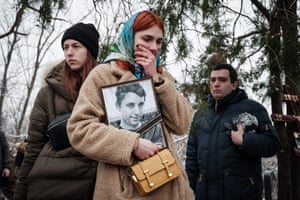 Sloviansk, UkraineKateryna Avdeyeva mourns as she holds a portrait of her late friend Oleksandr Korovniy, from the Azov battalion, who was killed in action at Bakhmut, as she attends his funeral ceremony in Sloviansk