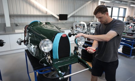 An engineer working on a Bugatti Baby.