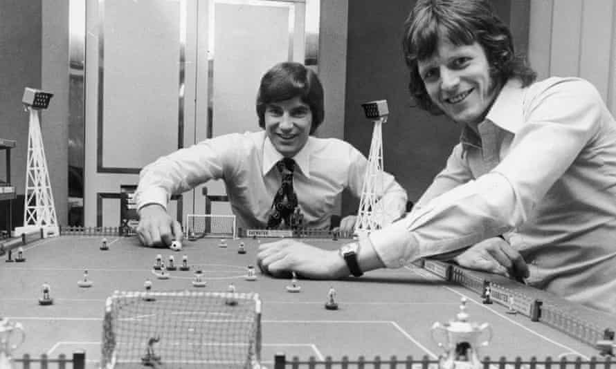Martin Buchan (left) of Manchester United and Mick Channon of Southampton engage in a game of Subbuteo before facing each other in the upcoming FA Cup Final at Wembley, 27th April 1976.