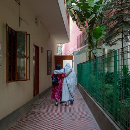 Jane embraces a nun as she leaves the Mother Teresa Orphanage in Old Dhaka, where she was adopted as a newborn in 1972.