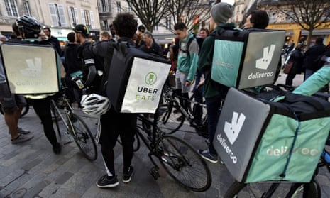 Deliveroo’s workers and other “uberised” bike messengers take part in a demonstration in Bordeaux, southwestern France, on March 15, 2017