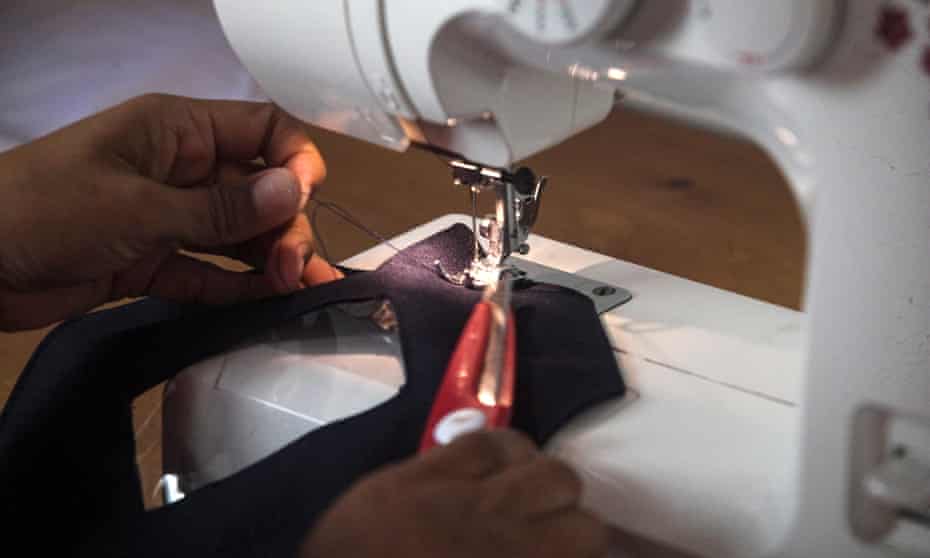 Person using sewing machine