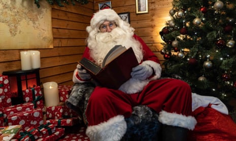 A Santa Claus from Santa’s Grotto Live in north London speaks to a family via Zoom