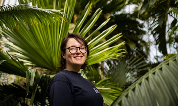 Brie Langley with the giant cycad at Kew Gardens in London.
