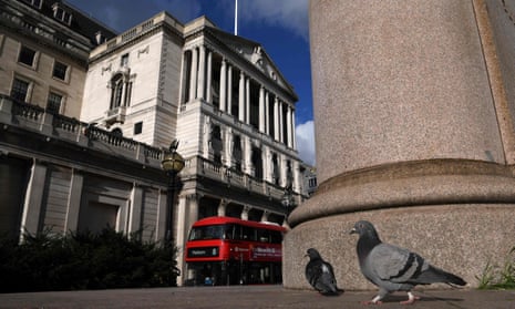 Pigeons are pictured in a general view of the Bank of England in the City of London