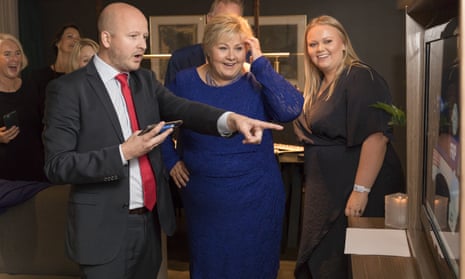 Norway’s prime minister, Erna Solberg, centre, with her daughter Ingrid Solberg Finnes and advisor Sgbjorn Aanes watch the election results.