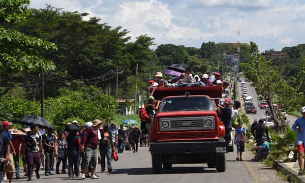 Honduran migrants take part in a caravan heading to the US, in the outskirts of Tapachula, Mexico.