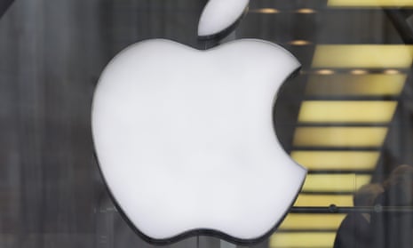 Man walks past Apple logo