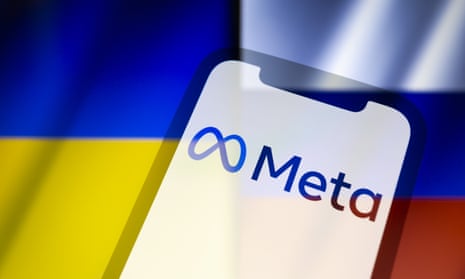 A multiple exposure image shows the logo of Meta on a smartphone over the backdrop of the flags of Ukraine and Russia.
