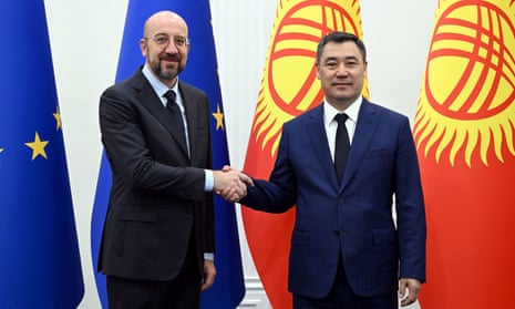 The president of the European Council, Charles Michel (left), shakes hands with the president of Kyrgyzstan, Sadyr Japarov, during his visit to Kyrgyzstan.