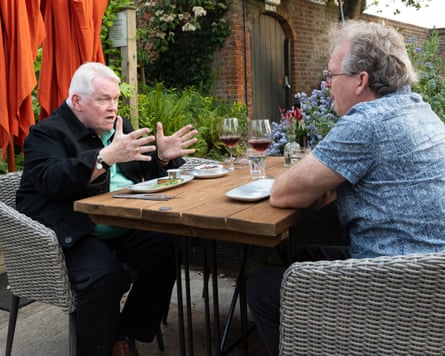Don and David chatting at an outside restaurant table