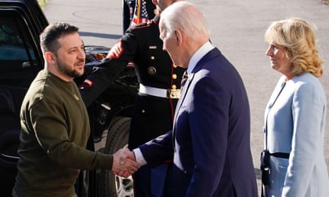 President Joe Biden shakes hands with Ukrainian President Volodymyr Zelenskiy as he welcomes him to the White House, Wednesday, Dec. 21, 2022, in Washington. First lady Jill Biden is at right.