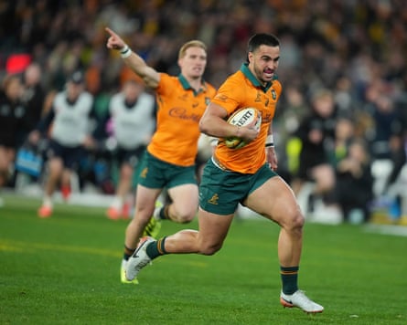 Australia’s Tom Wright runs in to score his side’s third try