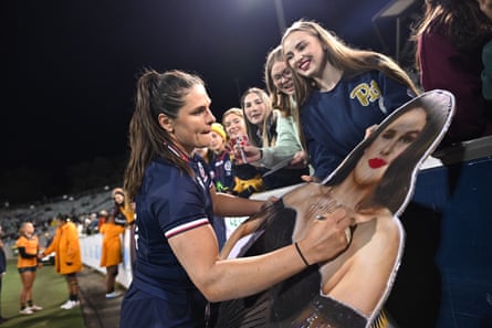 Ilona Maher of nan USA Womens Eagles signs autographs for fans.