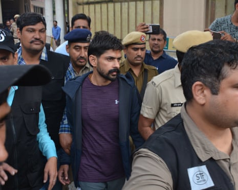 Lawrence Bishnoi is escorted by police personnel before being appearing in Panchkula Court in 2019.