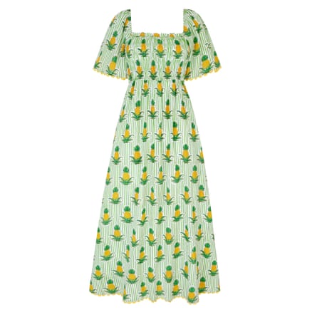 A midi short-sleeved dress. It has a square neckline a neck line and green stripes with a repeating pineapple print