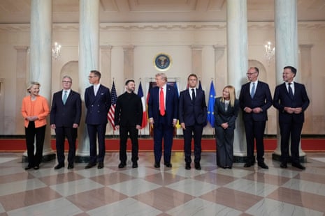 Donald Trump and Volodymyr Zelenskyy stand in the centre of a group photo of European leaders taken in the White House on 18 August 2025.