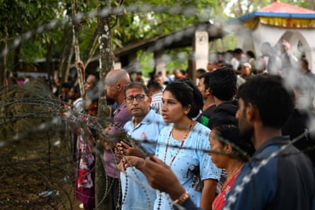 People wait for information about their missing relatives outside a military camp in the Trishuli area of Nepal’s Nuwakot district.