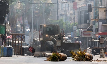 An Israeli army bulldozer drives through Jenin.