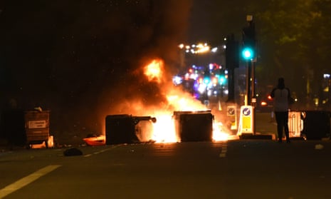 Makeshift road blocks on fire at a protest in Kingsland Road in east London, where people gathered in response to the death of Rashan Charles.