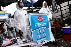 Members of the pro-democracy and civil society movement FILIMBI carry out a public educational campaign about coronavirus in a market in Congo’s capital Kinshasa in May.