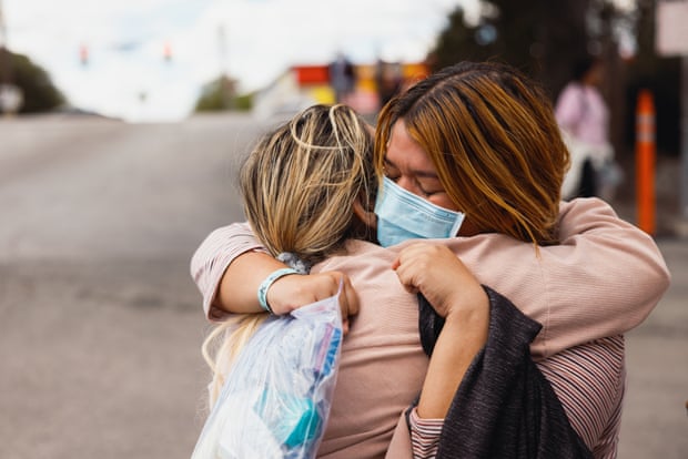 two women hug