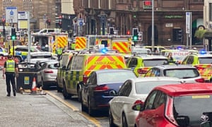 The emergency services in West George Street, Glasgow on Friday.