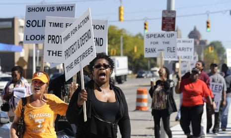 FILE - In this Sept. 23, 2015 file photo, protestors picket outside UAW Solidarity House in Detroit against the provisions of a tentative contract agreement reached with Fiat Chrysler. The next two days will be critical in deciding the fate of a new four-year contract between Fiat Chrysler and the United Auto Workers. (David Coates/The Detroit News via AP, File)