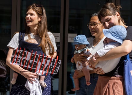 A group of mothers, midwives and campaigners host a breastfeeding protest outside the Ministry of Justice to demand an end to prison for pregnant women and new mothers in the UK.
