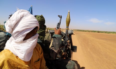 Fighters from a local armed groups patrol, aiming to lower the number of weapons in circulation in and around the city of Menaka, situated between Mali, Niger and Burkina Faso.