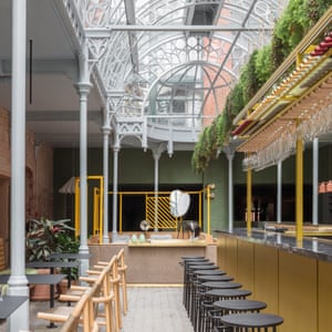 Bar area with its atrium-stylings at Whitworth Locke in Manchester, UK.