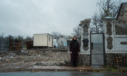 Elena Kalinichenko’s shot of her friend outside the ruins of her home in Ukraine.