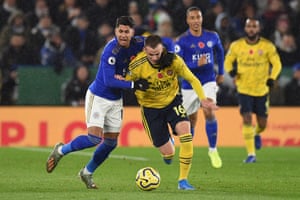 Arsenal’s Rob Holding tangles with Leicester City’s Spanish striker Ayoze Perez.