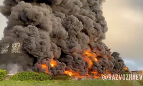 Smoke rises after a suspected drone attack on an oil depot in Sevastopol, Crimea, in a video image