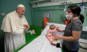 The pope visiting a family at the Bambino Gesu Children’s Hospital in Rome.