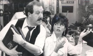 Gorden Kaye as René Artois, the hapless owner of a provincial cafe in Nazi-occupied France, with Vicki Michelle as Yvette, one of the waitresses, in ’Allo ’Allo!, 1986.