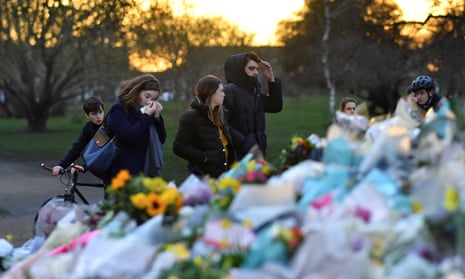 People at the site of the Clapham Common bandstand in London after the death of Sarah Everard.