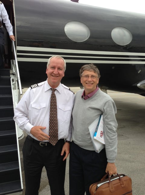 Bill Gates boards a private jet.