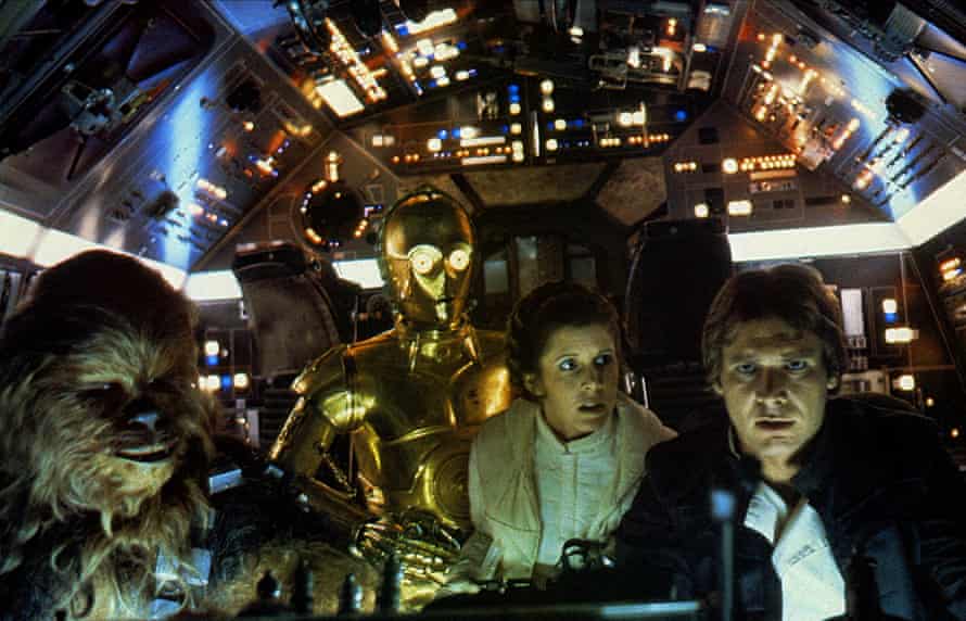 Chewbacca, C-3PO, Princess Leia Organa and Harrison Ford as Han Solo in Star Wars: Episode IV - A New Hope, 1977.