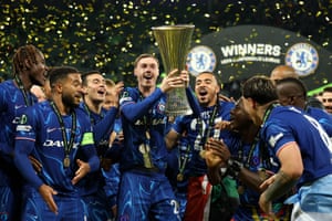 Cole Palmer of Chelsea lifts the Conference League trophy surrounded by fellow team players, after their victory over Real Betis