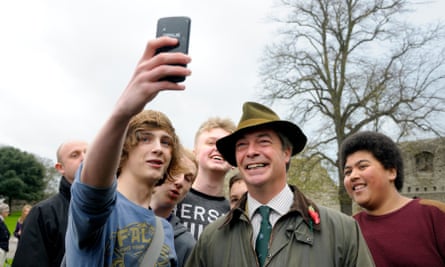 Nigel Farage campaigning in Rochester in 2014, in the kind of country attire that was his signature.