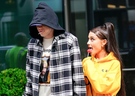 Ariana Grande and Pete Davidson, sucking on lollipops and holding hands, in New York, 20 June 2018