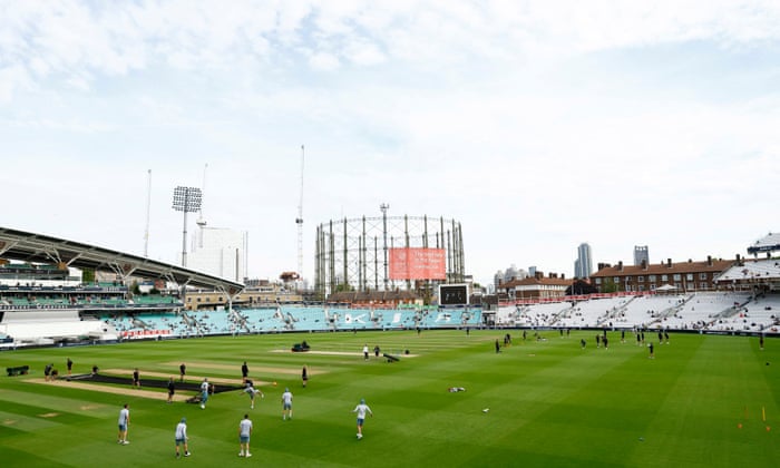 The players warm up at The Oval before play.