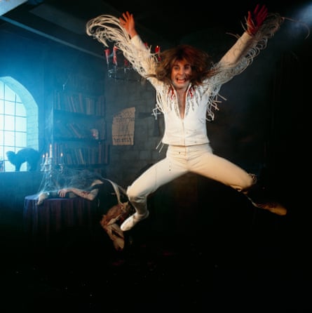 Ozzy Osbourne leaps in the air during a photoshoot for the cover of Diary of a Madman.