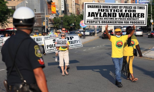 Marchers in Newark, New Jersey hold placards