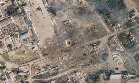 This handout satellite photo taken and released by Planet Labs PBC on July 12, 2022, shows the aftermath after artillery fire on a site in Nova Kakhovka, in the southern Ukrainian region of Kherson occupied by Russian forces.