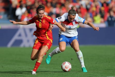 Lucy Bronze competes for the ball
