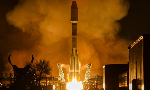 A Russian Soyuz-2.1b carrier vehicle with OneWeb communication satellites launches at Baikonur Cosmodrome in Kazakhstan.