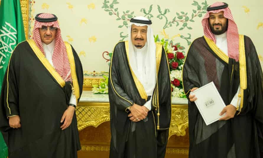 Crown Prince Mohammed bin Nayef, King Salman, and Deputy Crown Prince Mohammed bin Salman stand together after Saudi Arabia’s cabinet agreed to implement the Vision 2030 reforms.