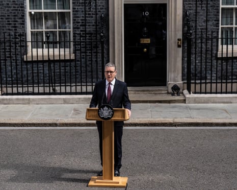 Keir Starmer stands at a podium featuring the UK government crest outside 10 Downing Street